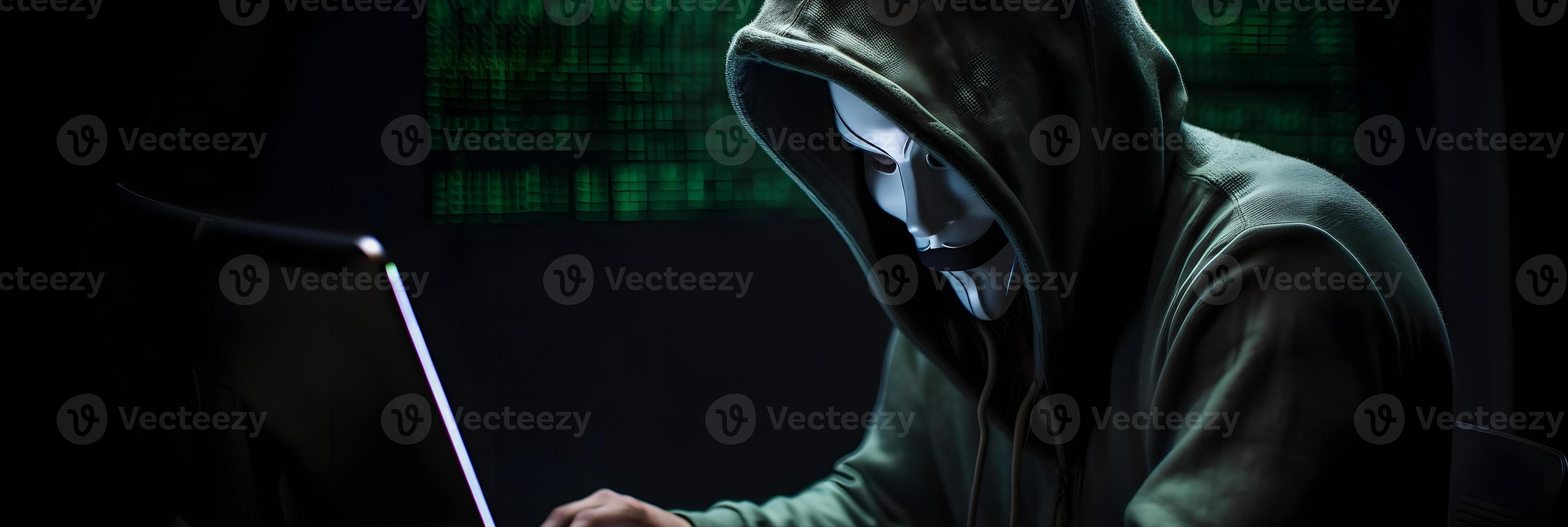 Unveiling the Enigmatic World of Cybercrime. A White Masked Hacker's Front View Amidst Dark Hood and Green Matrix Code Background photo