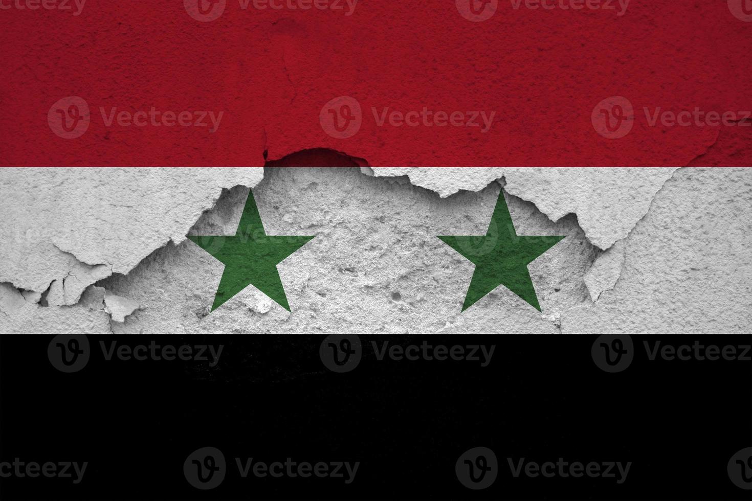 Earthquakes in Syria, flag Syria on a wall with cracks from an earthquake photo
