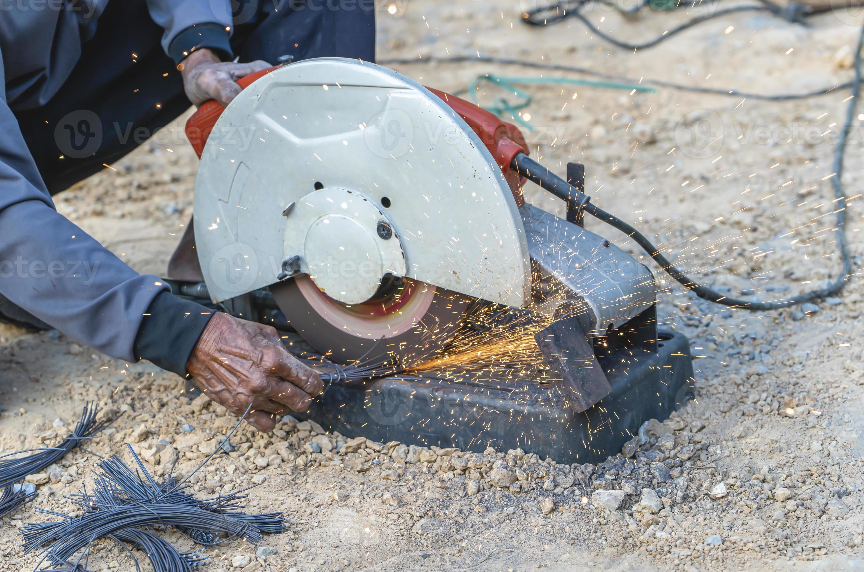 Man's hand using iron cutter in the workplace, fastening iron canopy