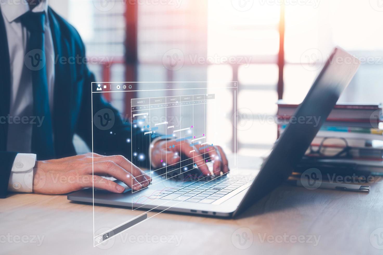 businessman, Analyst doing an Analytics and Data Management System on laptop computer, report with KPI and metrics database. Corporate strategy for finance, operations, sales, marketing. photo