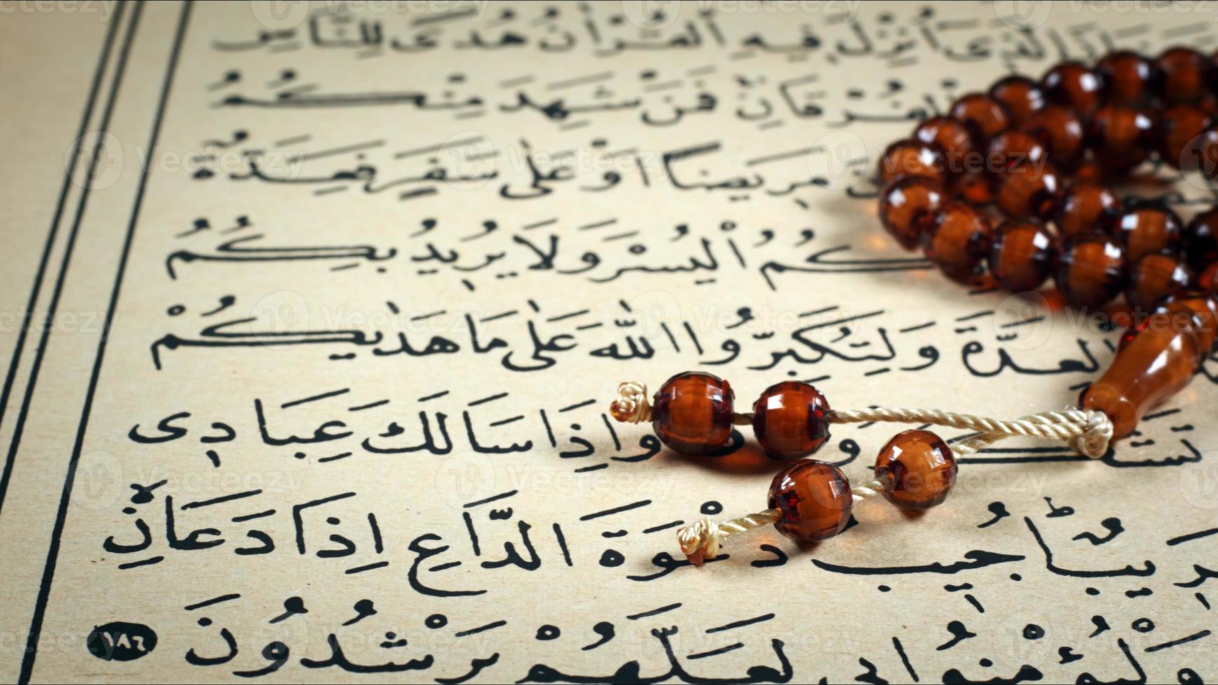 Quran the holy book of muslim religion and Pray Counting Bead photo