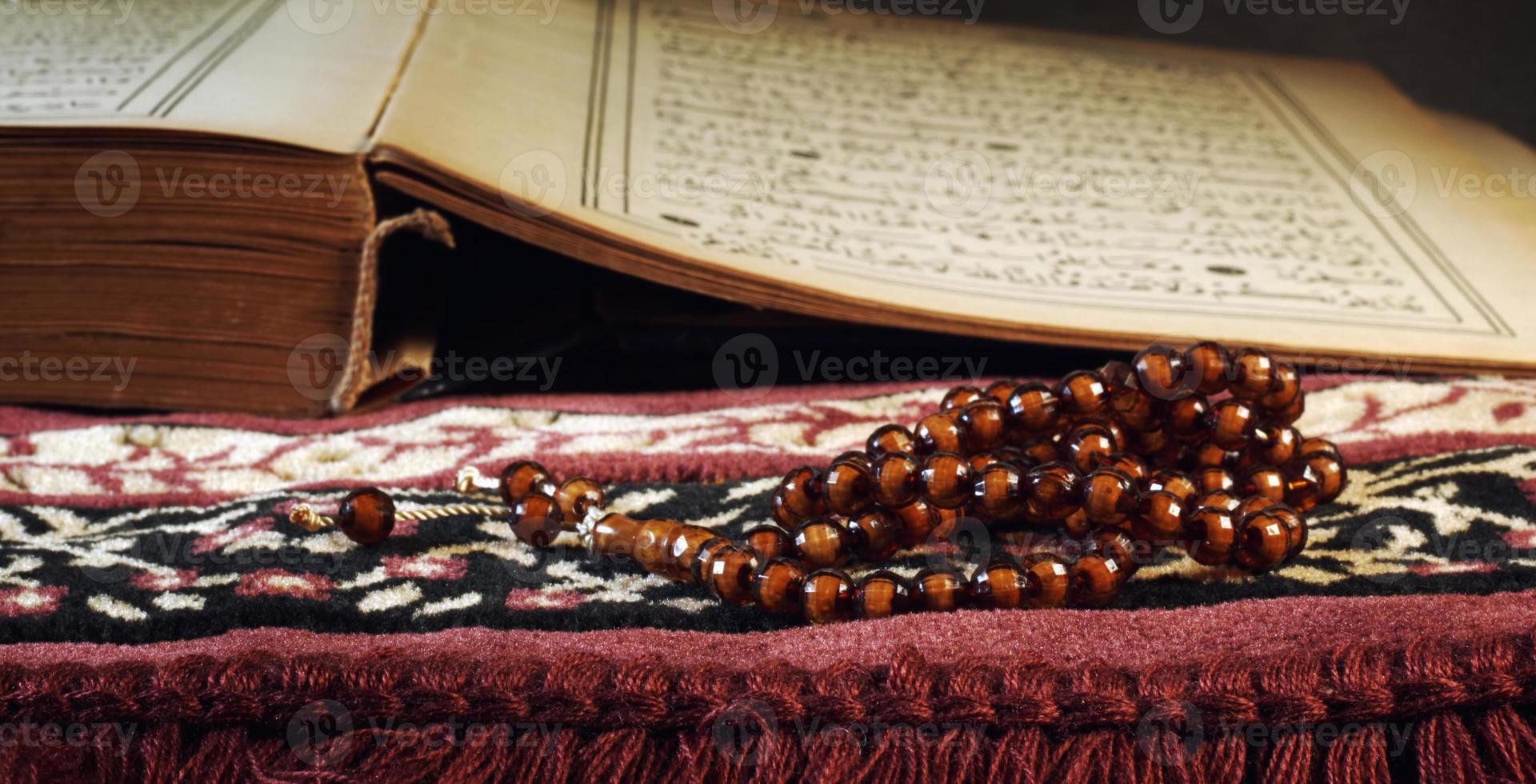Quran the holy book of muslim religion and Pray Counting Bead photo