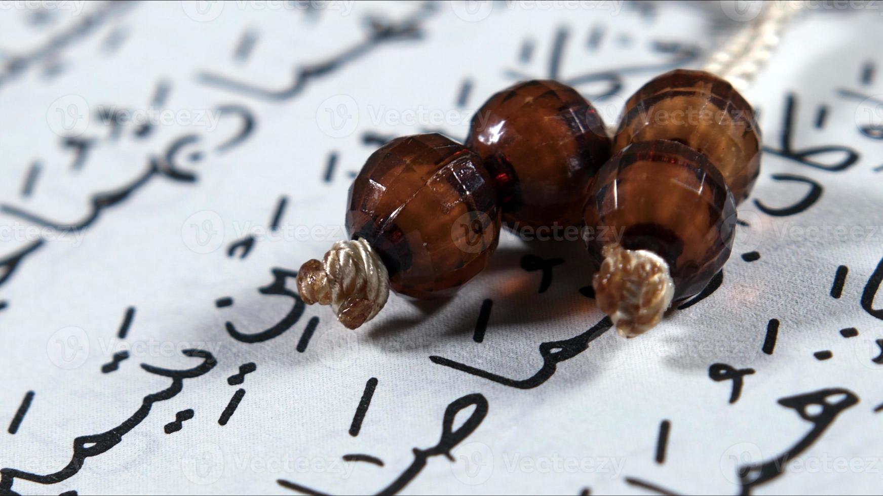 Quran the holy book of muslim religion and Pray Counting Bead photo