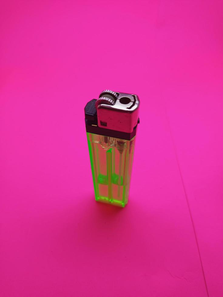 gas lighter with pink background isolated picture photo