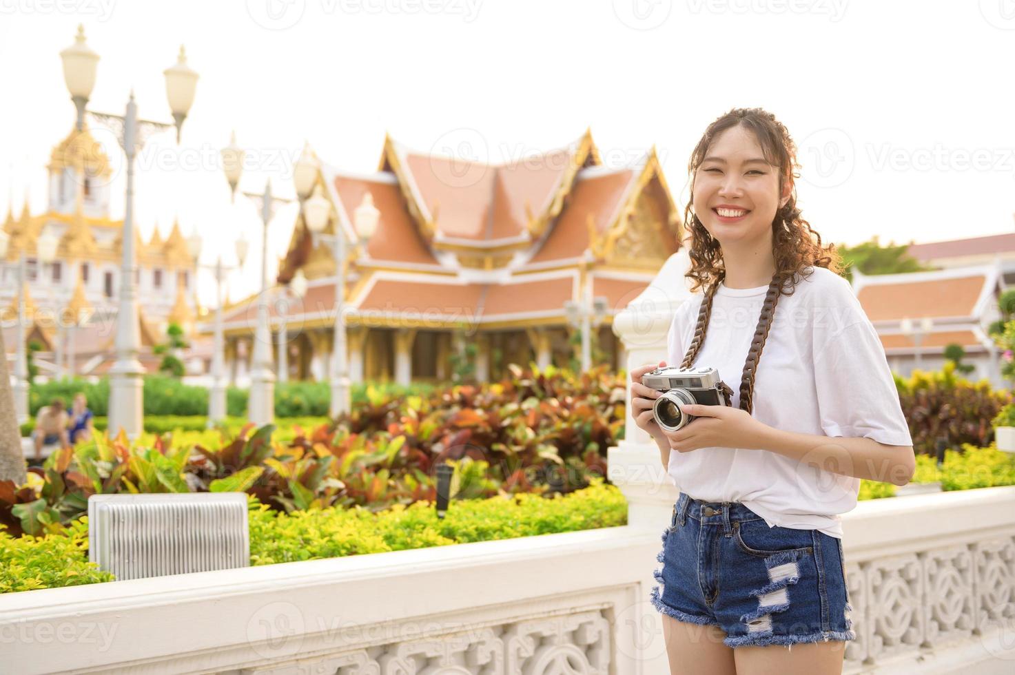 Beautiful young Asian tourist woman on vacation sightseeing and exploring Bangkok city, Thailand, Holidays and traveling concept photo