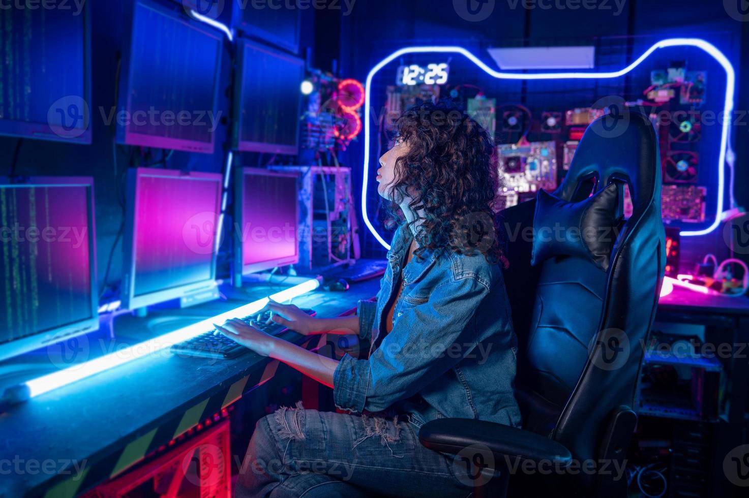 an asian woman programmer is working in her computer room , futuristic technology concept photo