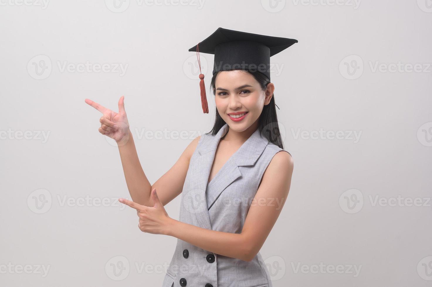 Young smiling woman wearing graduation hat, education and university concept photo