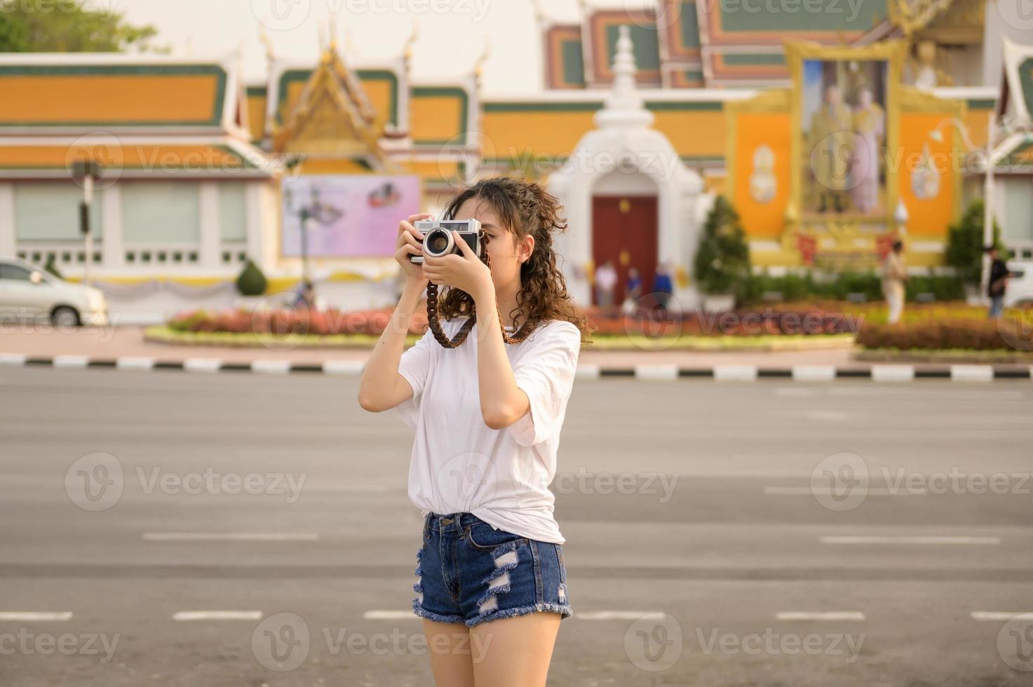 Beautiful young Asian tourist woman on vacation sightseeing and exploring Bangkok city, Thailand, Holidays and traveling concept photo