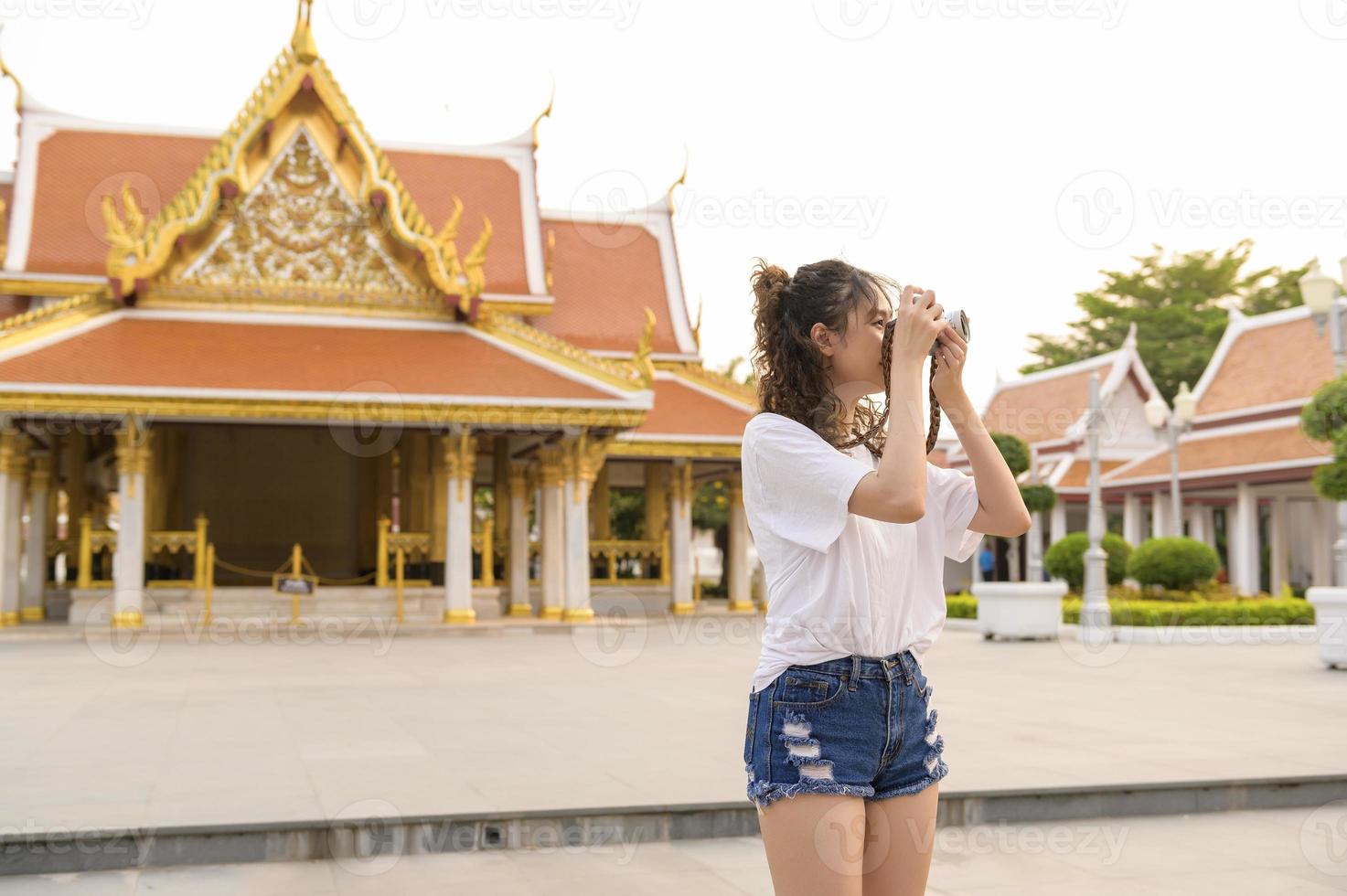 Beautiful young Asian tourist woman on vacation sightseeing and exploring Bangkok city, Thailand, Holidays and traveling concept photo