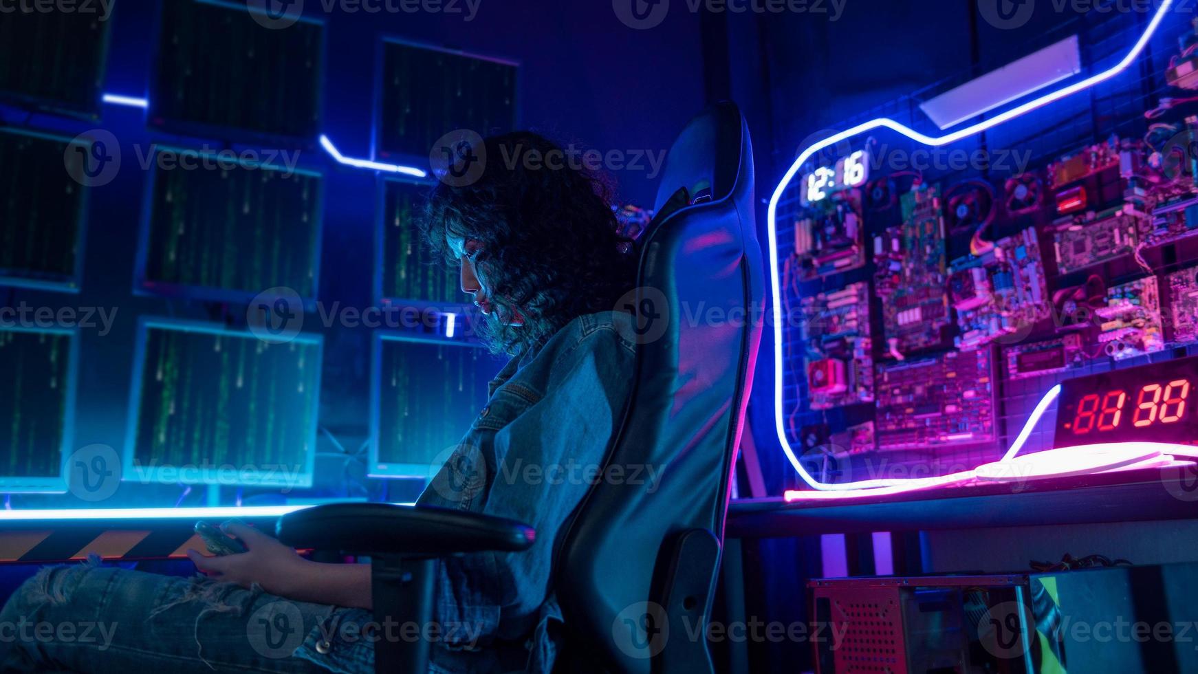 an asian woman programmer is working in her computer room , futuristic technology concept photo