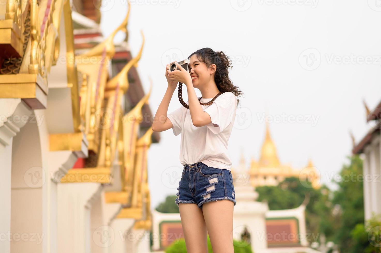 Beautiful young Asian tourist woman on vacation sightseeing and exploring Bangkok city, Thailand, Holidays and traveling concept photo