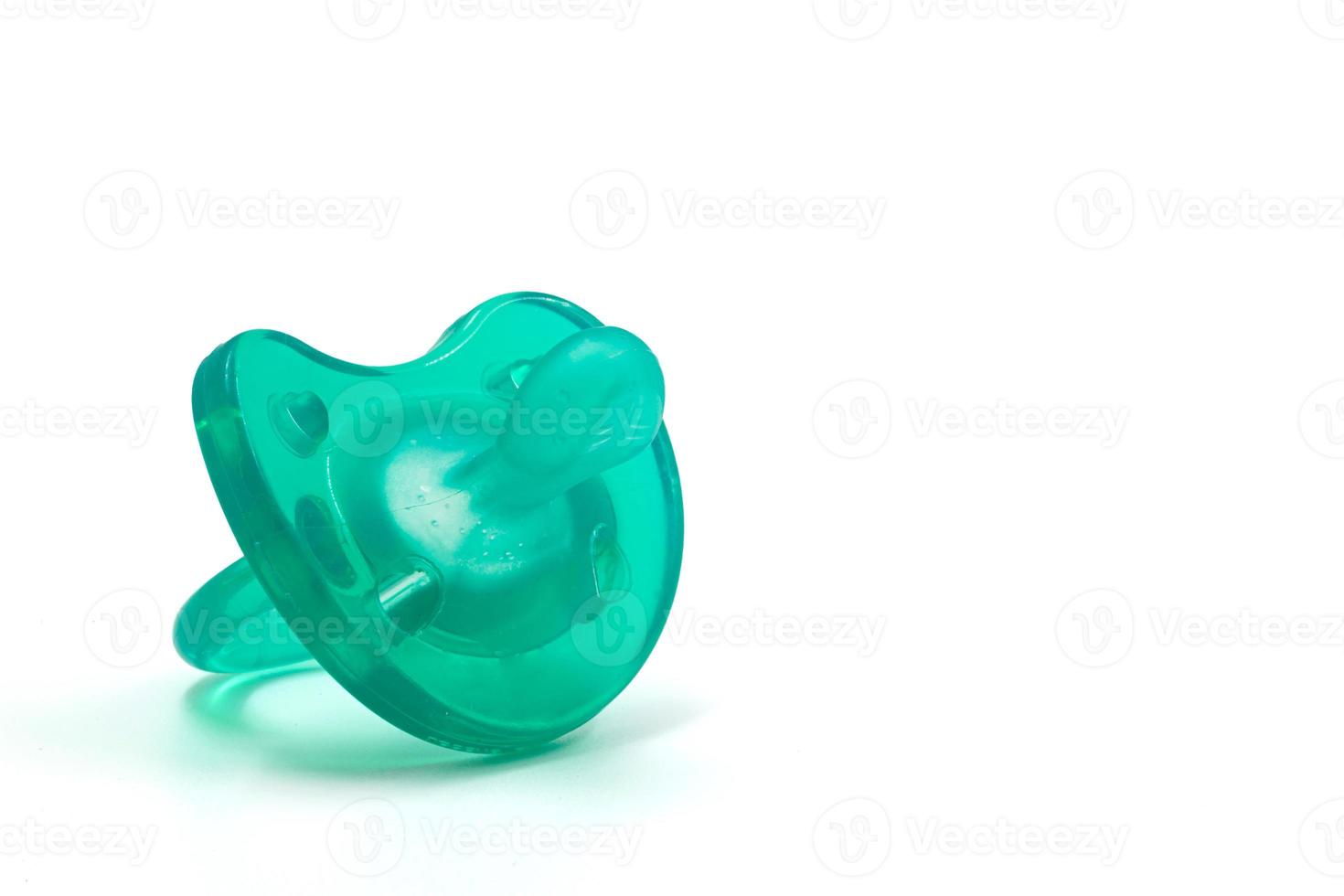 Turquoise pacifier for a newborn on a white insulated background. Background. For text. Photo in high quality