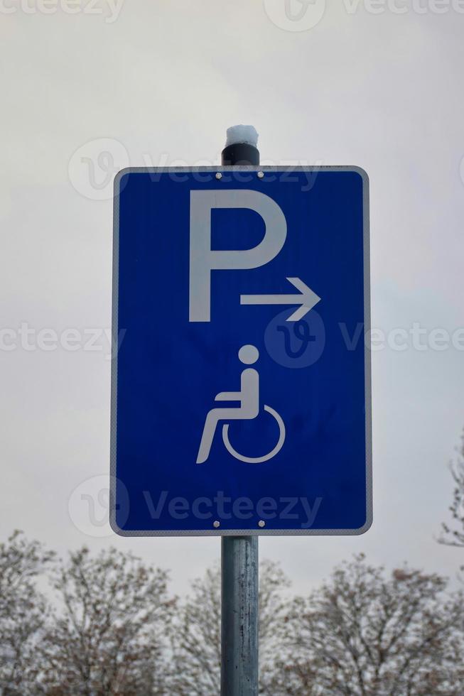 Park signs for disabled persons. Person in a wheel chair. photo