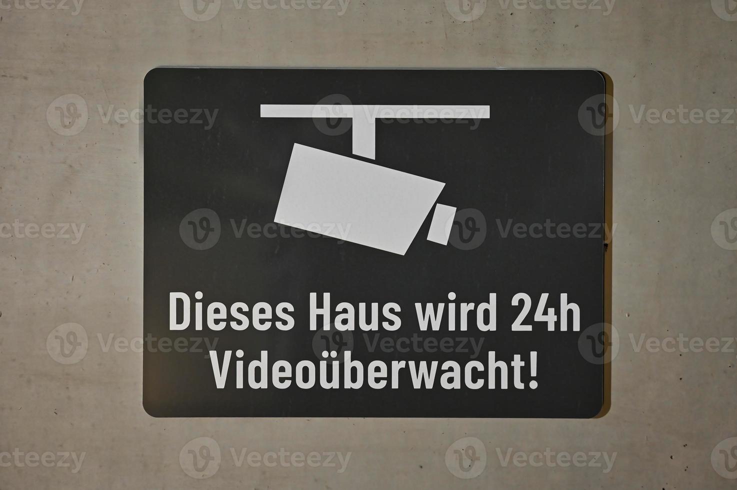 German sign Dieses Haus wird 24h Videoueberwacht english This house is under video surveillance 24 hours a day photo