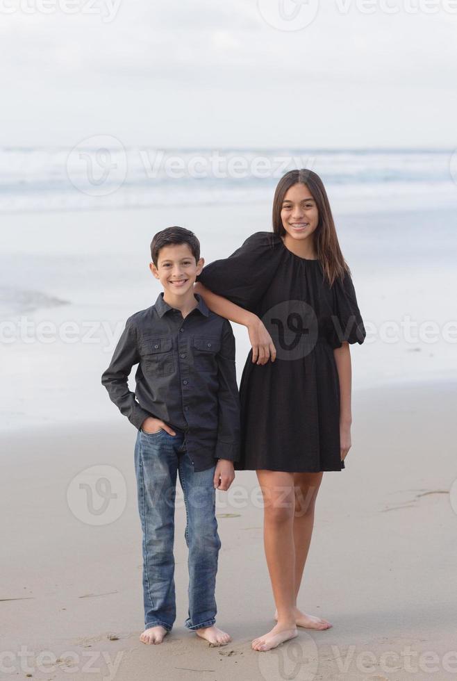 Siblings on the beach photo