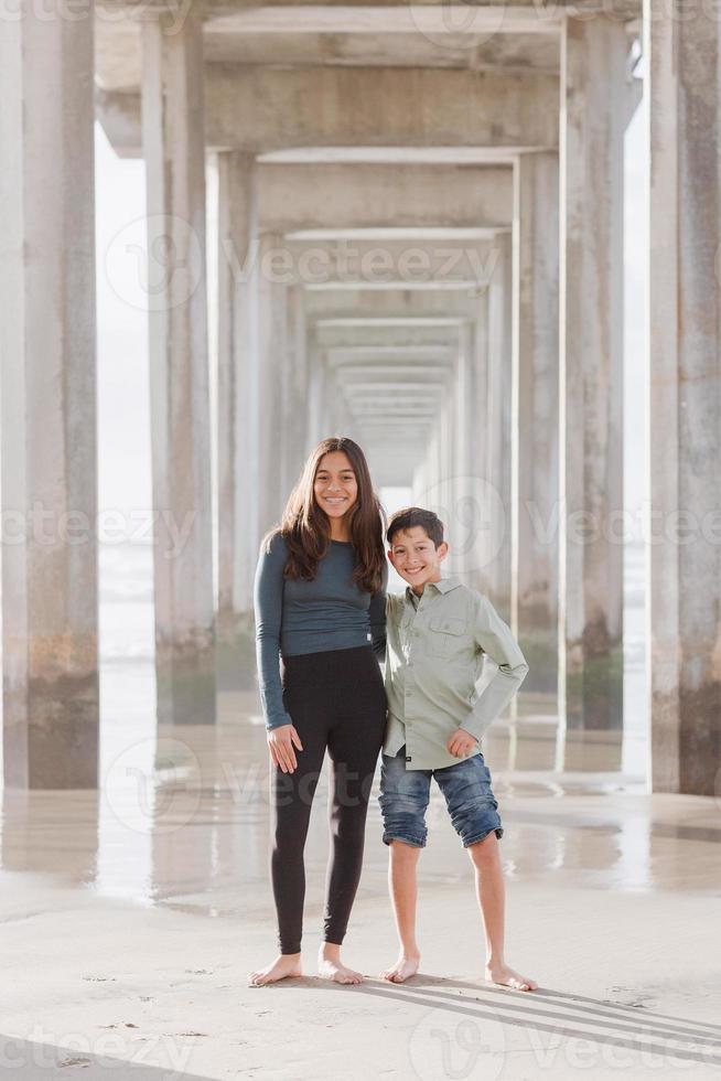 Siblings on the beach photo