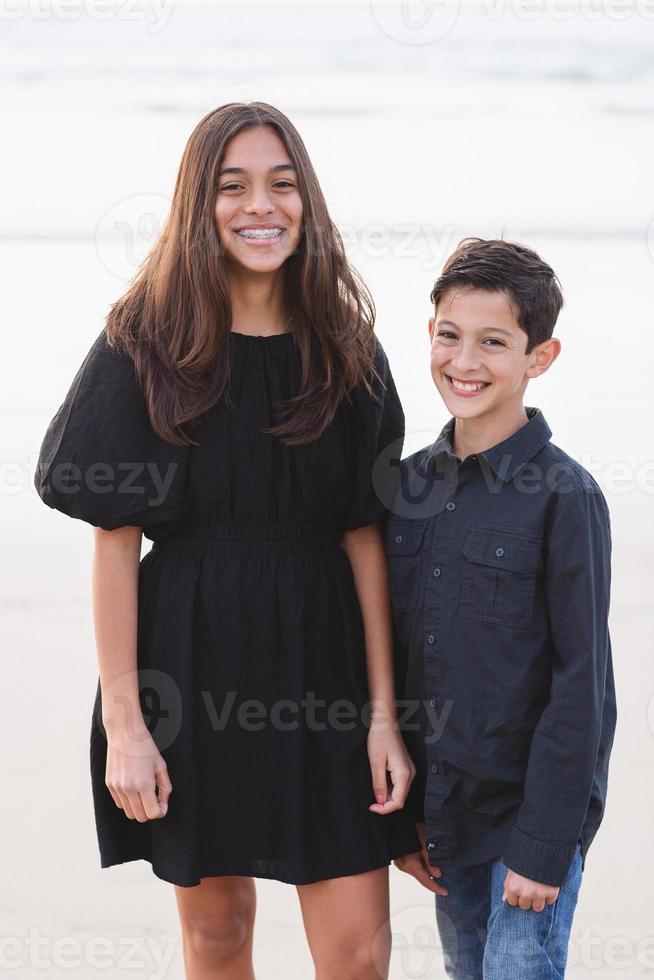 Siblings on the beach photo