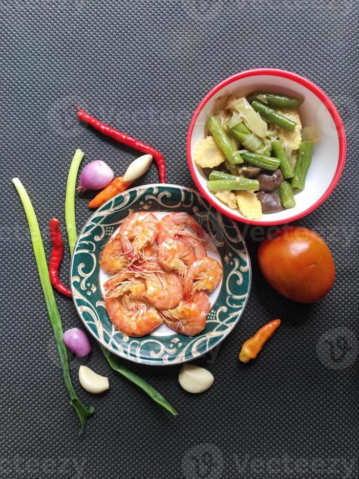 salad with corn and shrimps in bowl, top view, copy space photo