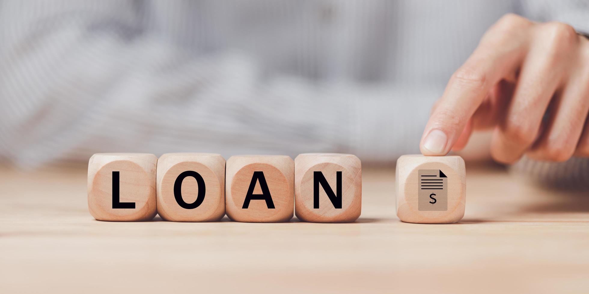 man pointing at a wooden block ,received banking loan approval ,Approval of a mortgage loan or purchase of real estate ,applying for financial credit,Financial loan agreement ,Mortgage application photo