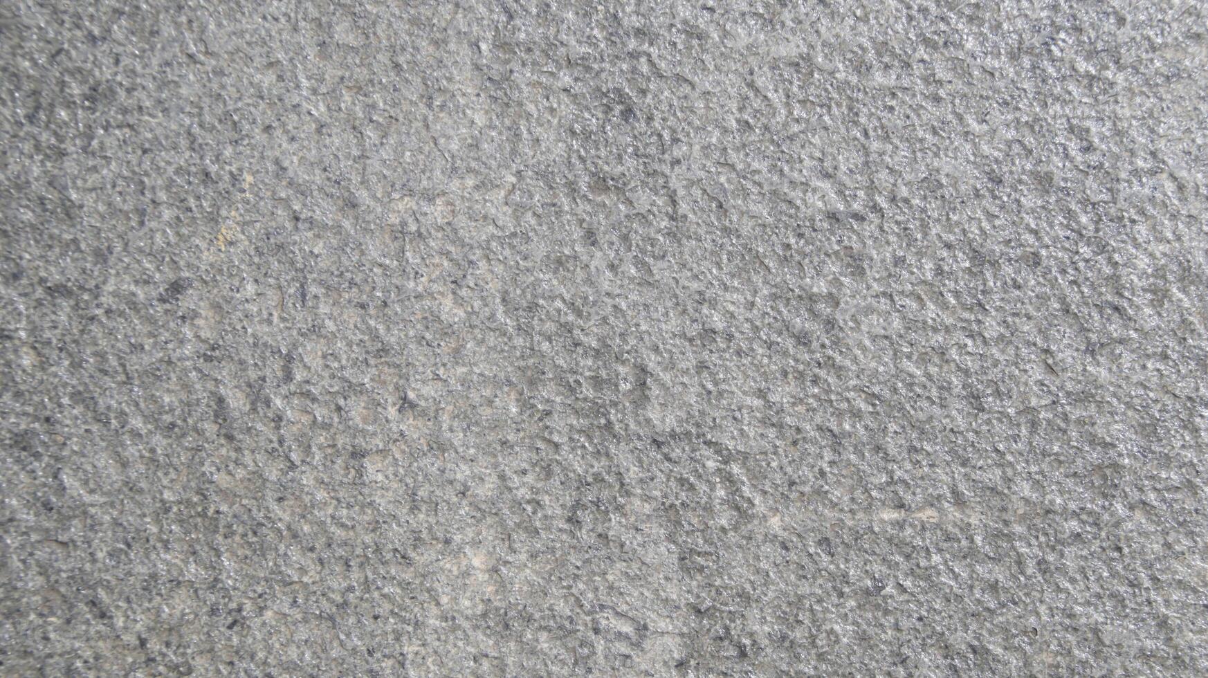 Close up macro view of rough grey stone surface. detailed nature background or pattern texture taken in natural environment. photo