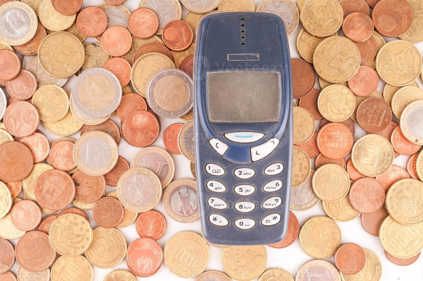 Cellphone and coins photo