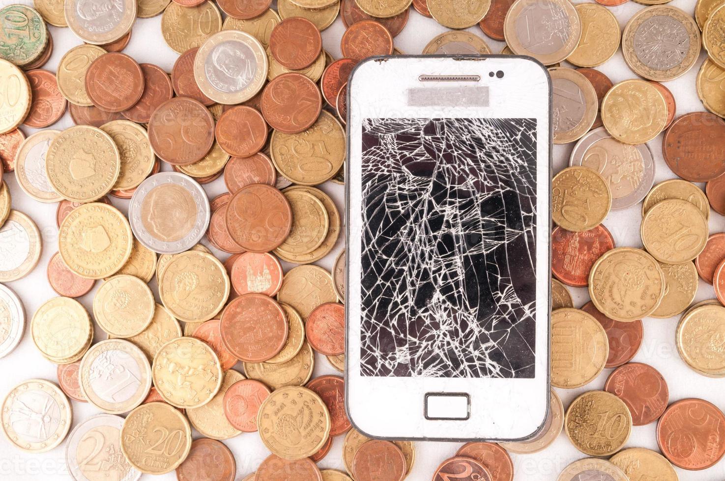 Smartphone and coins photo