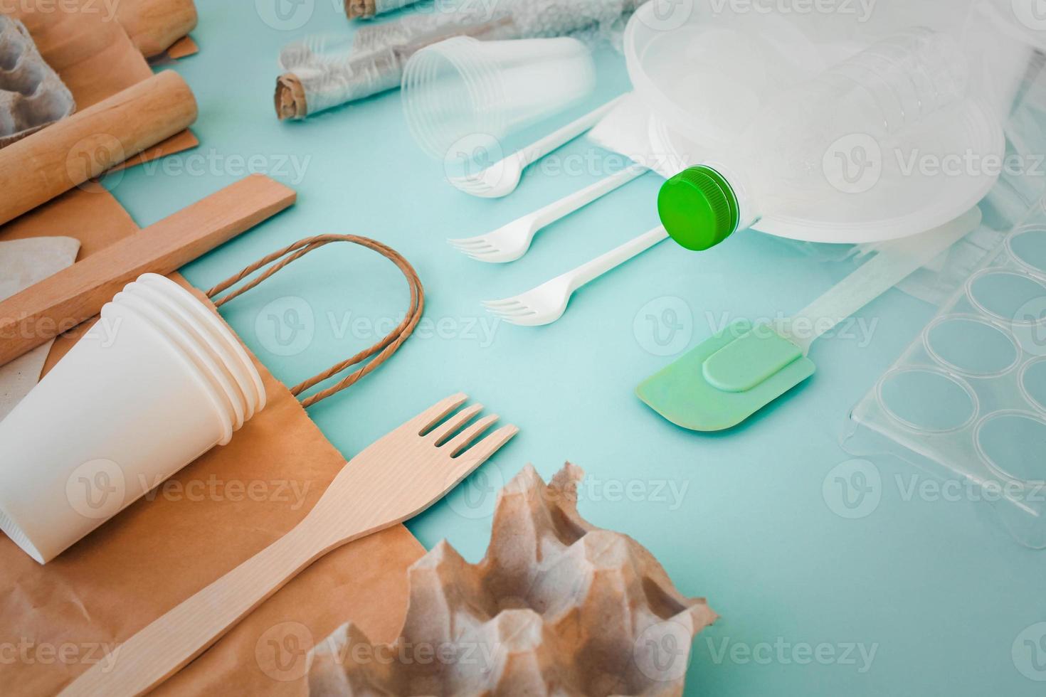 Set of plastic items and replacing them with eco  tableware wooden and paper bag. Zero waste concept. photo