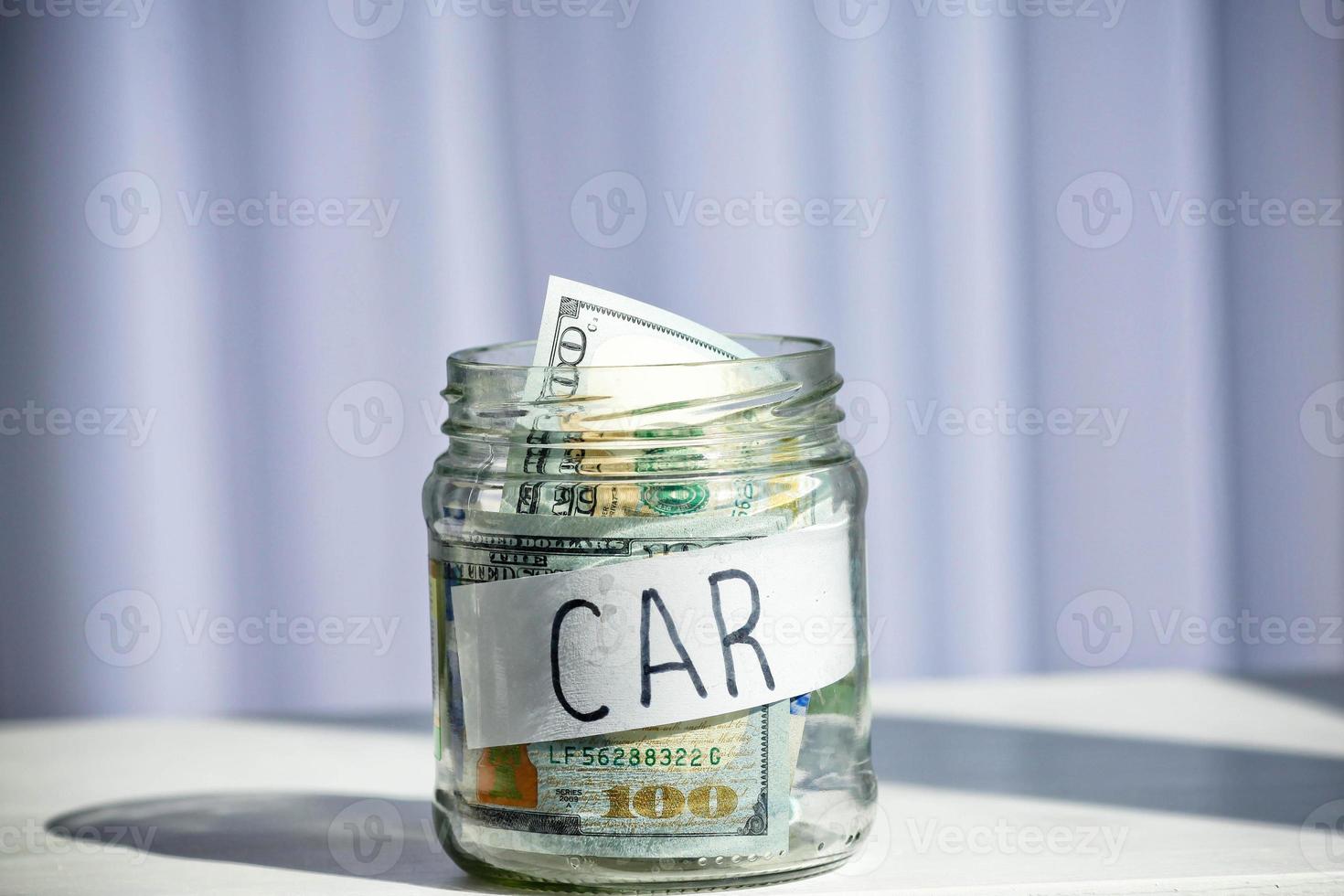 Glass jar with the inscription car. photo