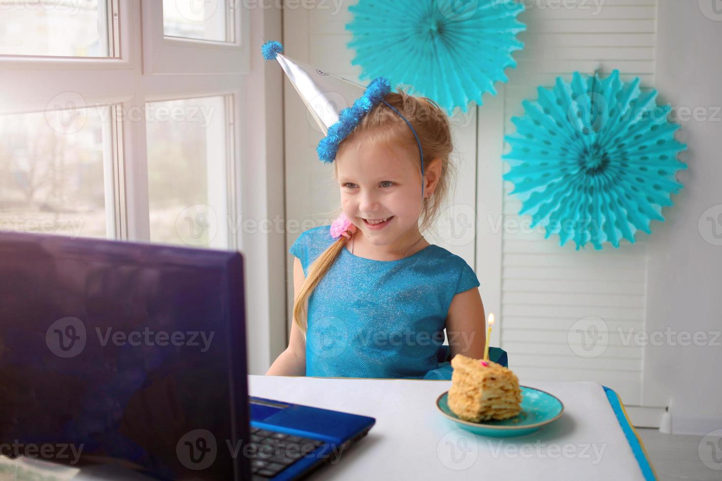 Happy girl  sibling celebrating birthday via internet in quarantine time, self-isolation and family values, online birthday party. photo