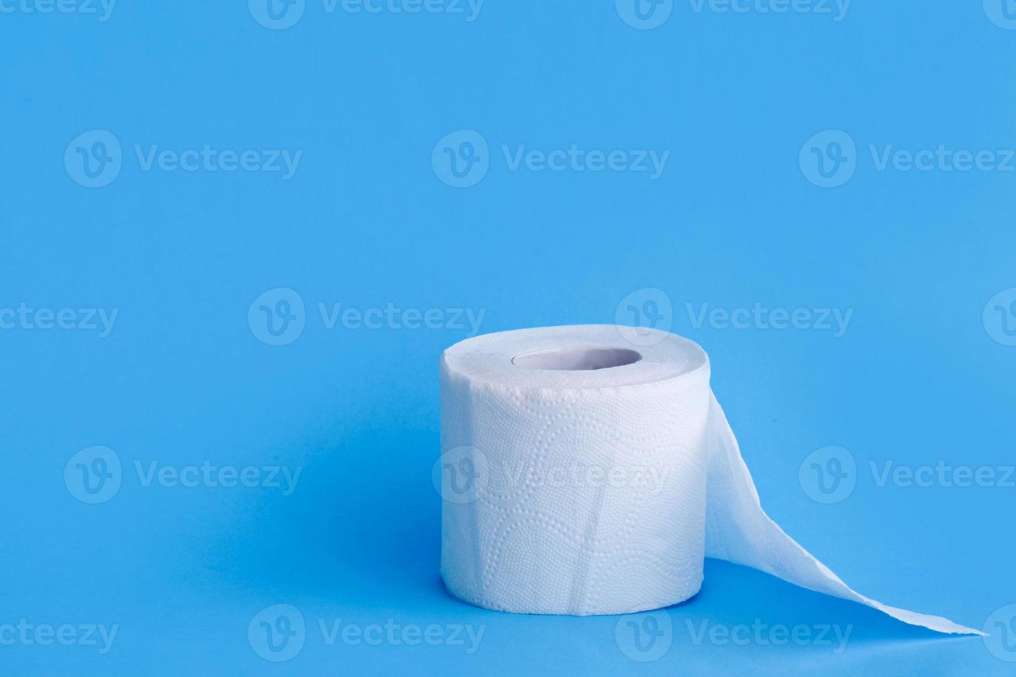 Toilet paper  on blue background. photo