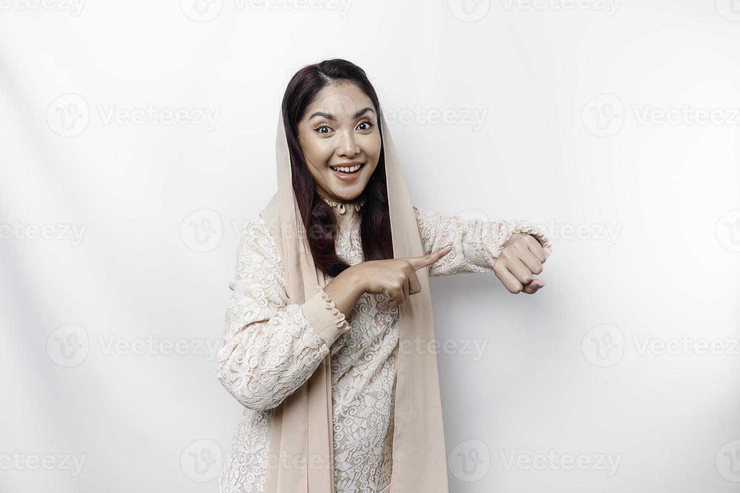 Hispanic Asian woman wearing headscarf doing time out gesture with hands, frustrated and serious face photo