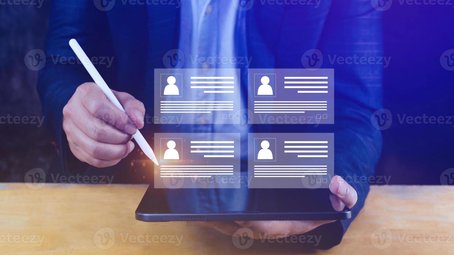 Human resources manager choosing professional profile to hire on virtual screen interface, recruitment concept. Businessman hand pointing icon resource HR management concept photo