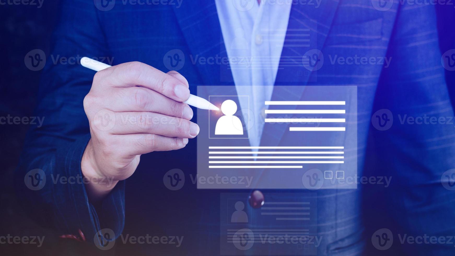 Human resources manager choosing professional profile to hire on virtual screen interface, recruitment concept. Businessman hand pointing icon resource HR management concept photo