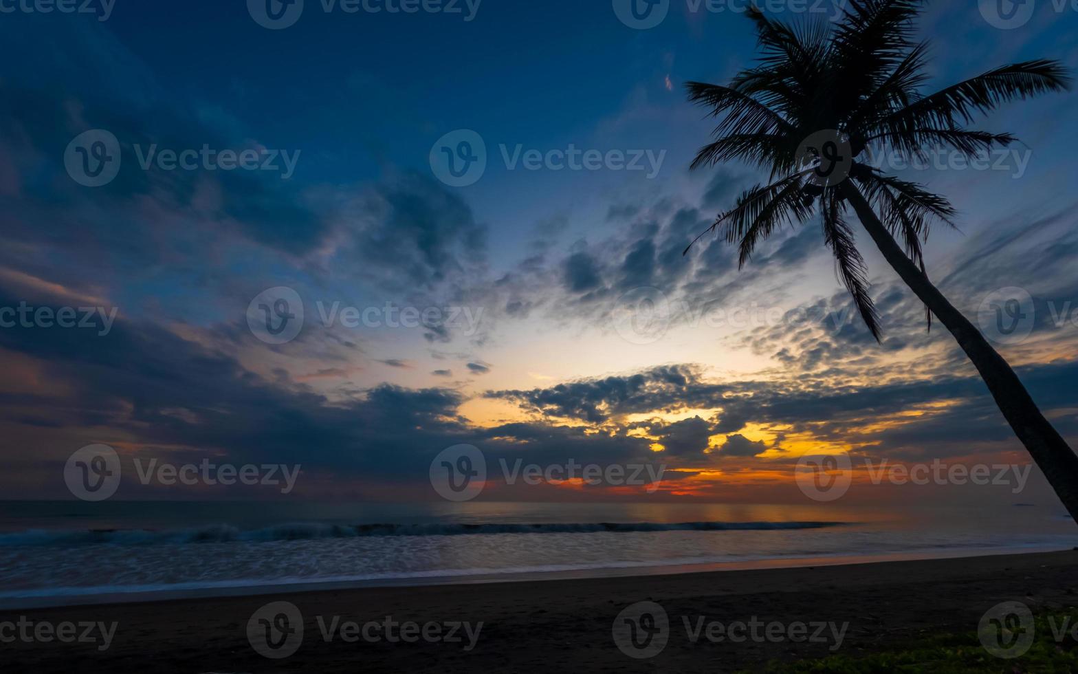 Beautiful tropical seascape, sunset at beach with colorful sky photo