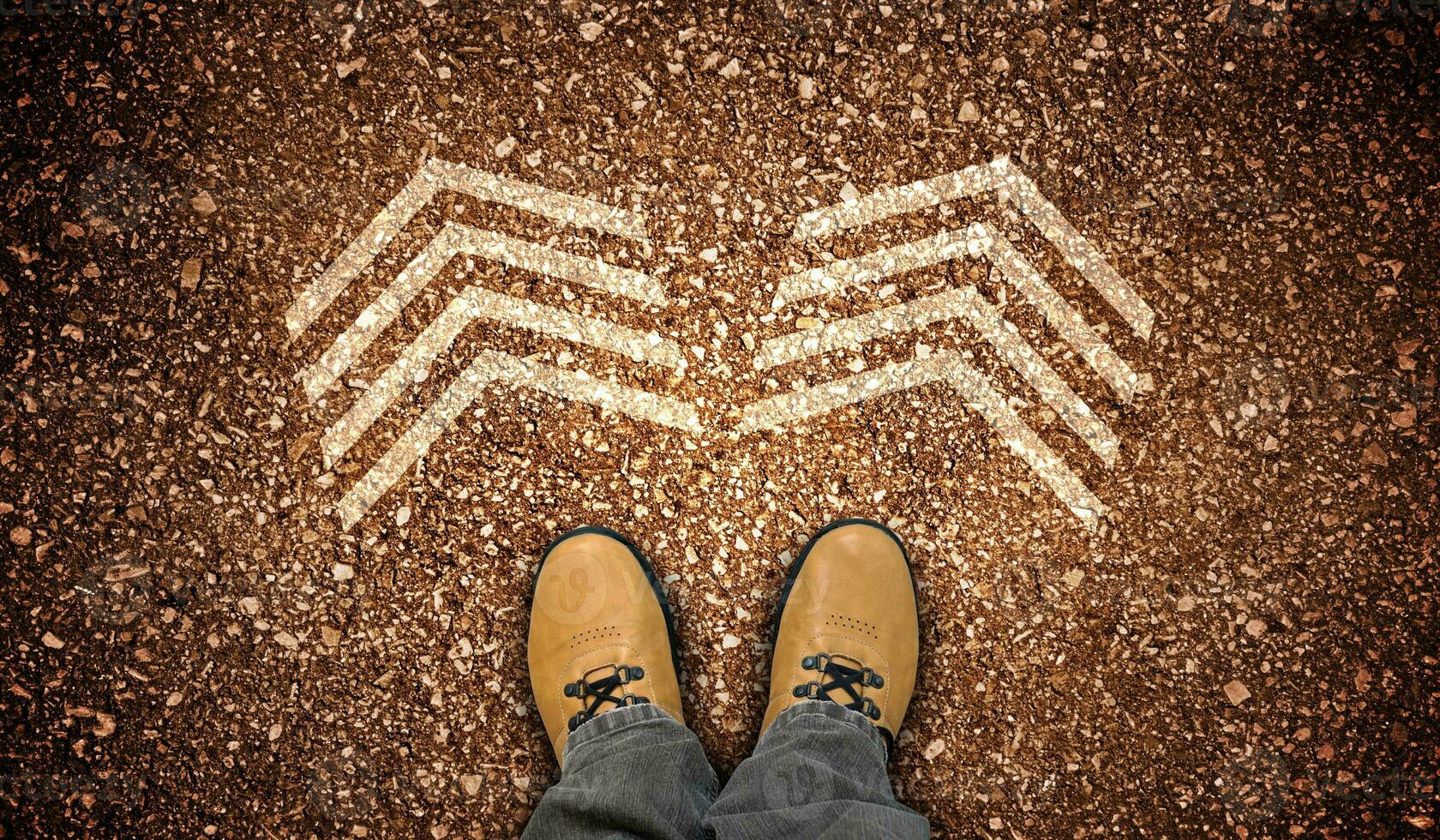 Yellow Leather Shoes and Two Chalky Arrows on Ground - Choice Concept photo
