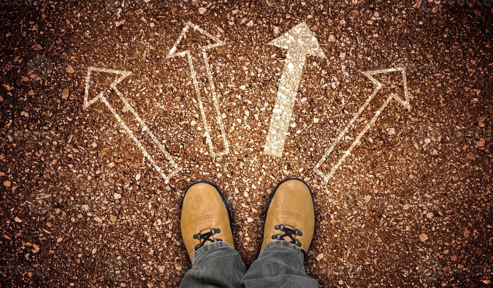 Yellow Leather Shoes and Four Chalky Arrows on Ground - Choice Concept photo