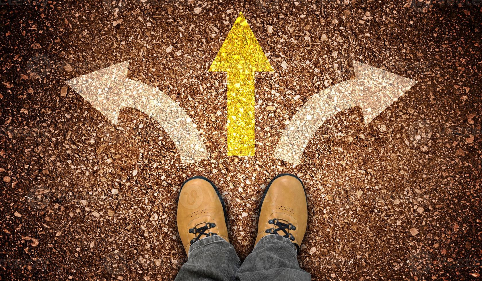 Yellow Leather Shoes and Three Chalky Arrows on Ground - Choice Concept photo