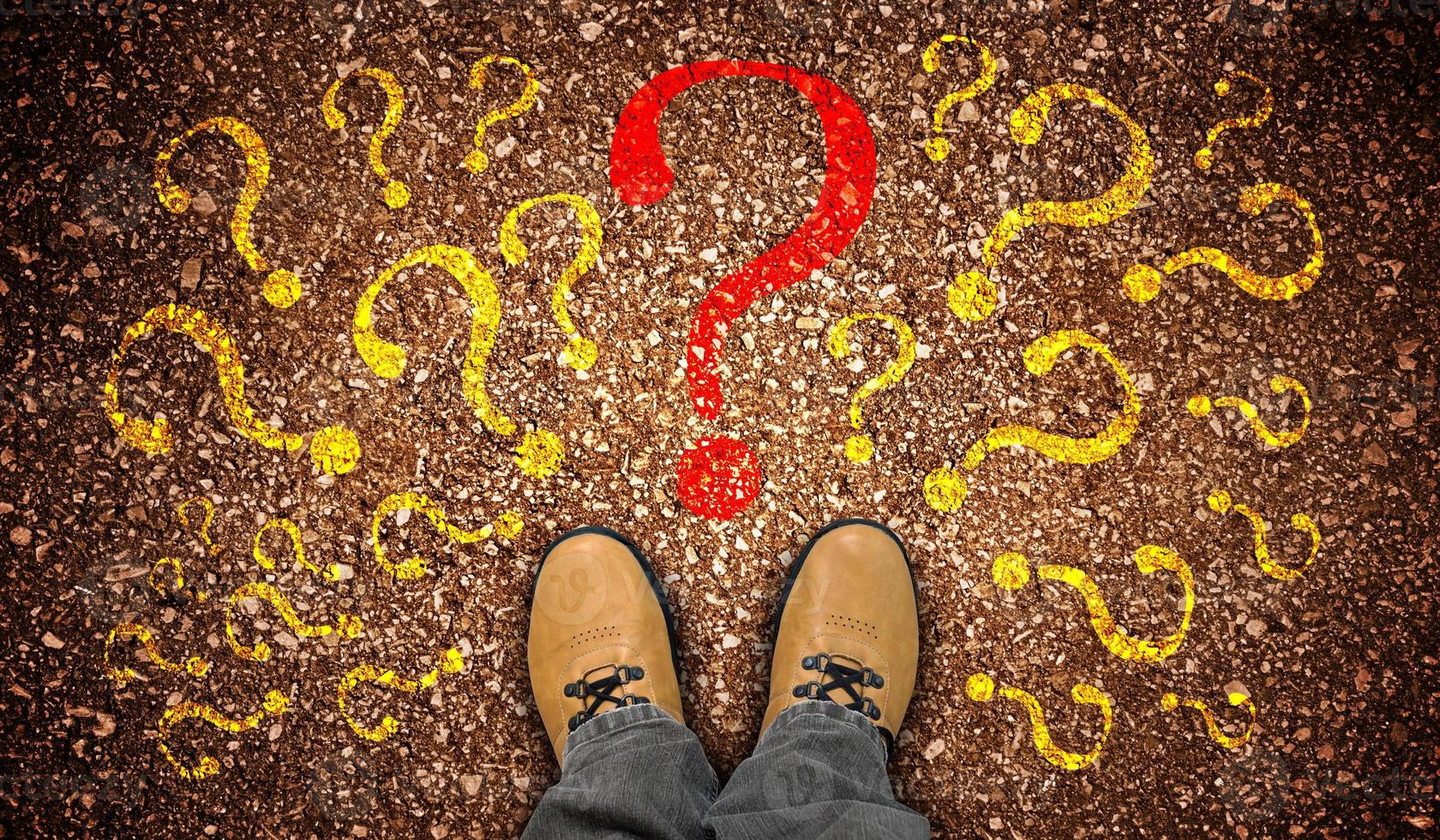 Yellow Leather Shoes and Many Colorful Question Marks - Doubt Concept photo
