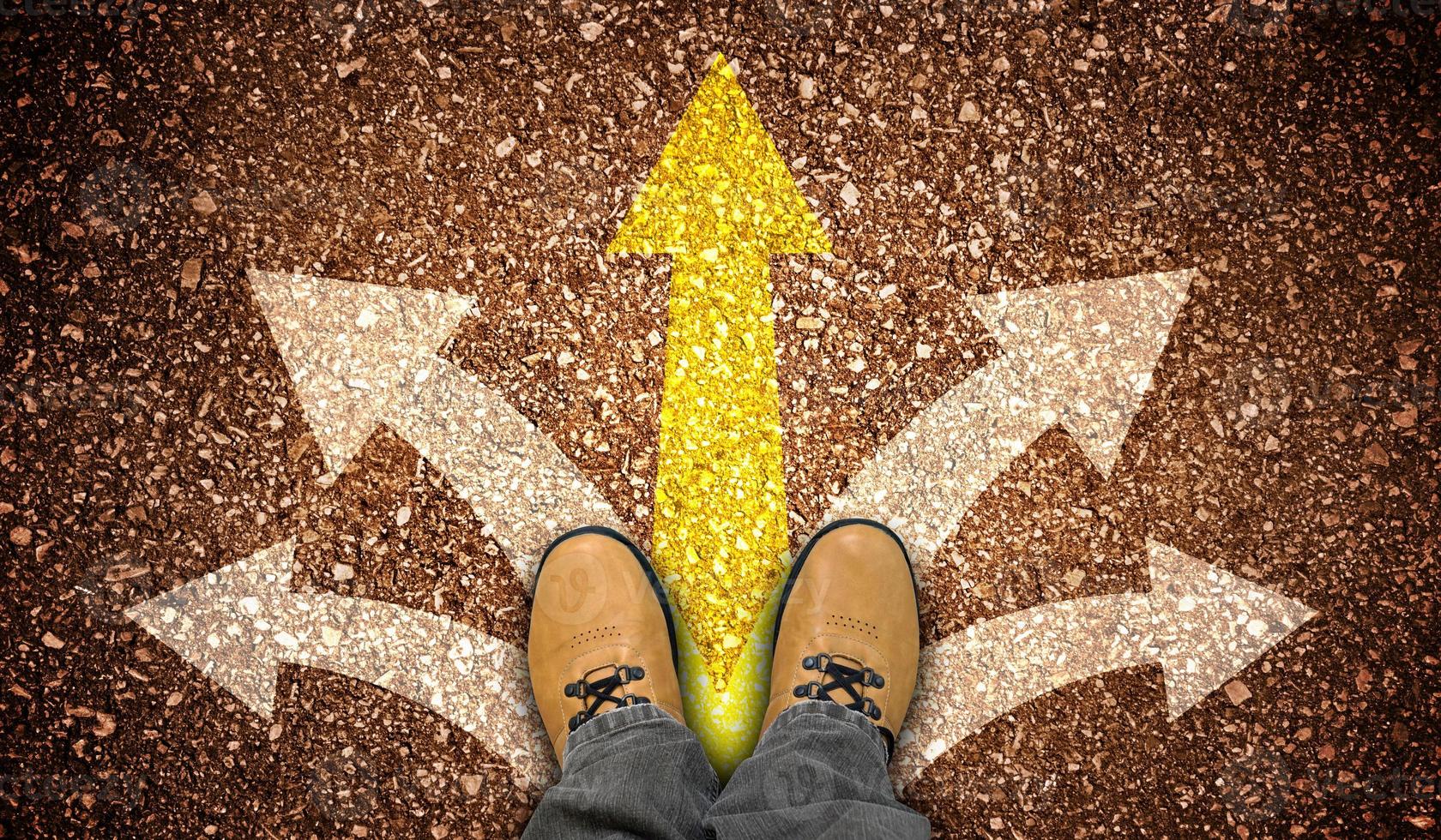Yellow Leather Shoes and Five Chalky Arrows on Ground - Choice Concept photo