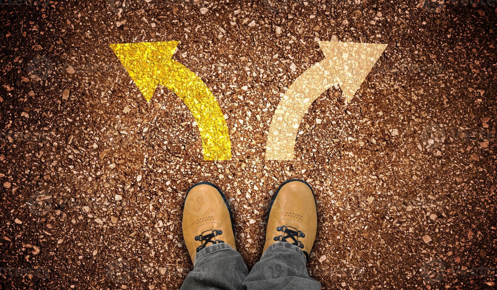 Yellow Leather Shoes and Two Colorful Chalky Arrows on Ground - Choice Concept photo