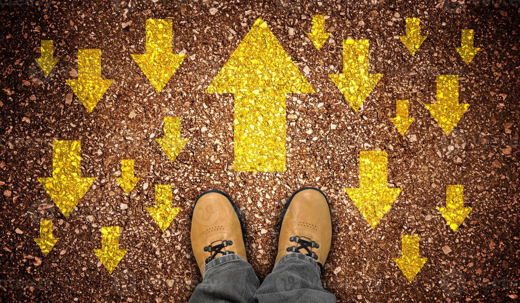 Yellow Leather Shoes and Colorful Chalky Arrows in Opposite Directions - Motivation Concept photo