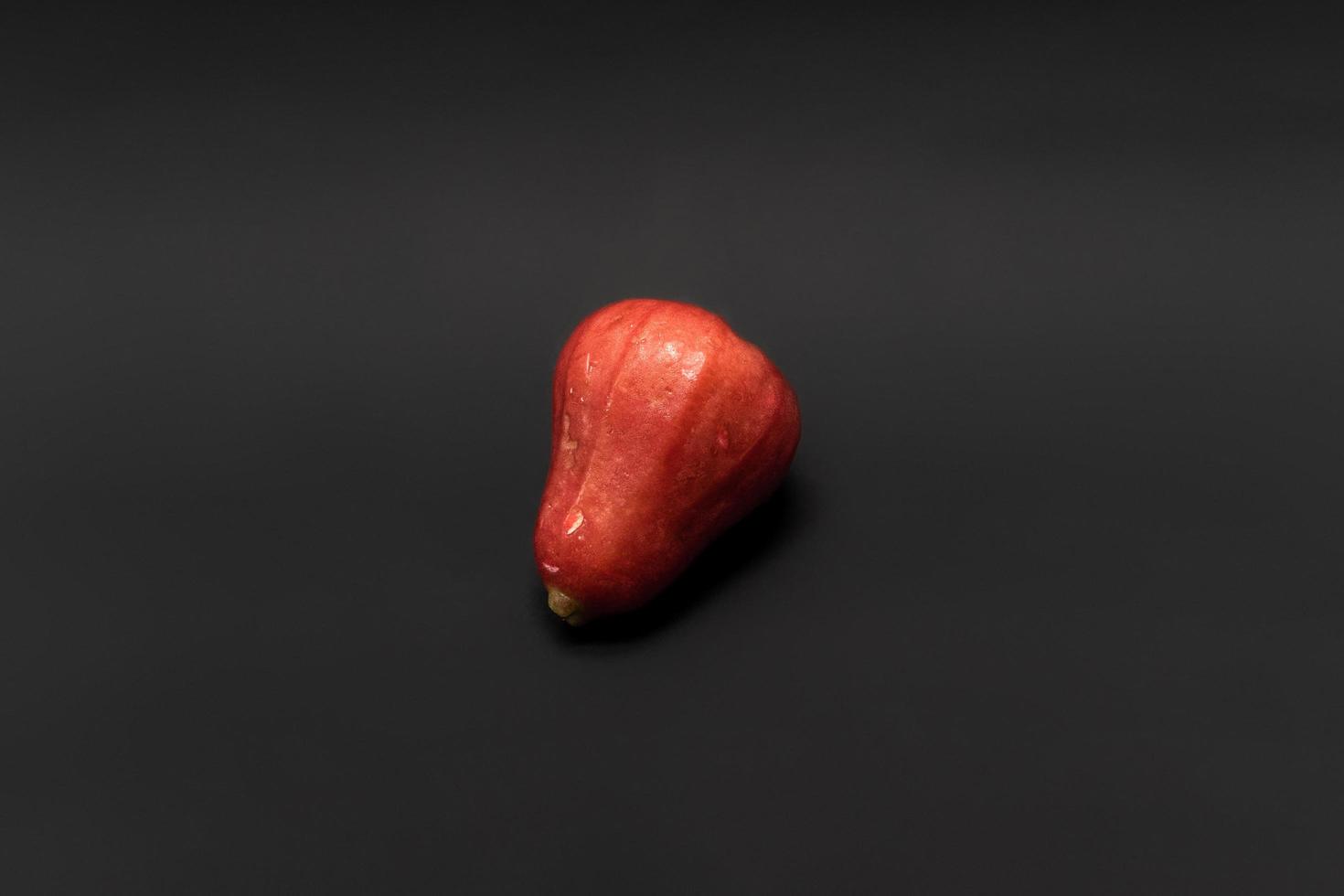 Guava isolated on black background, after some edits. photo