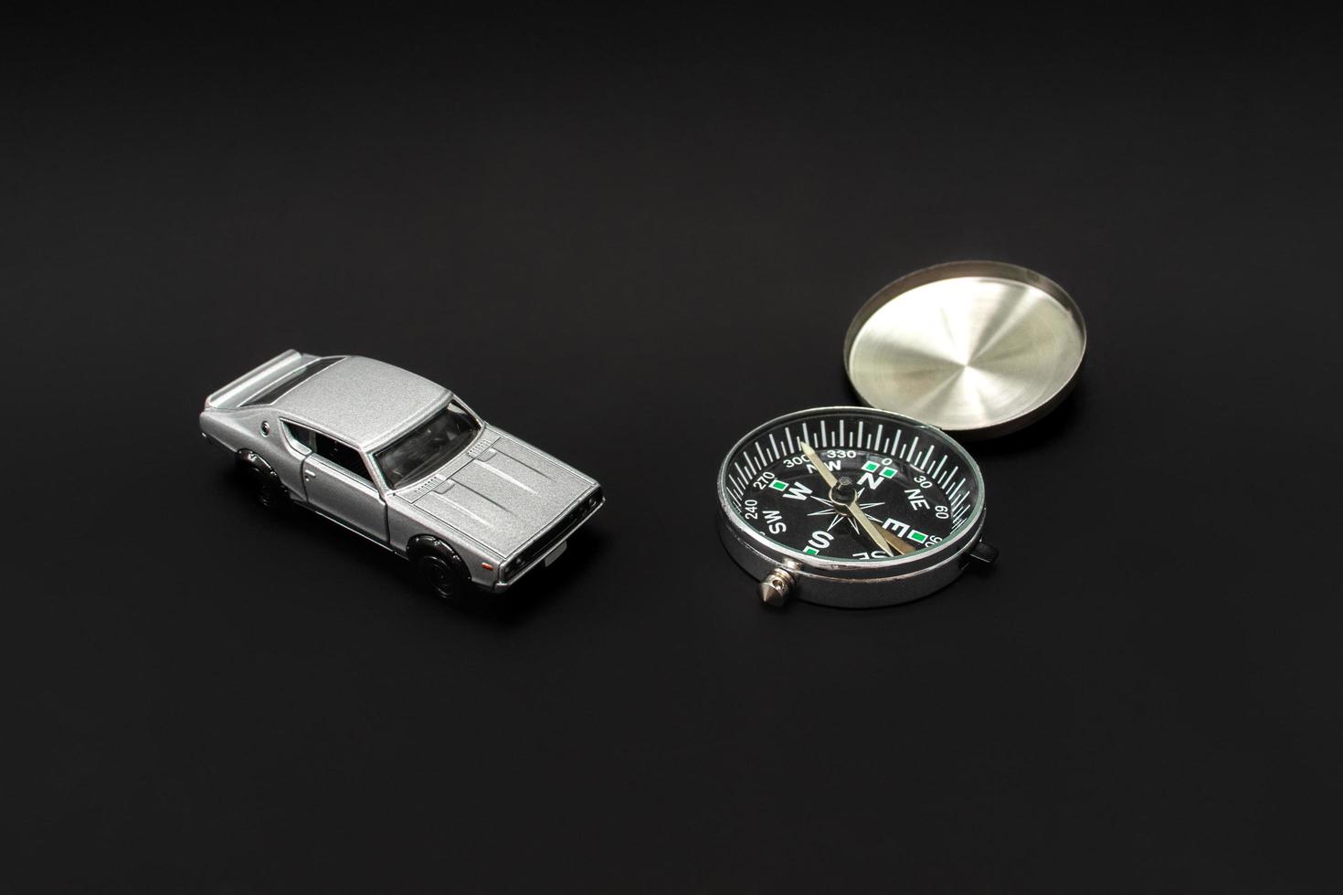 Concept for traveling. Need a guidance like compass or other navigation for traveling. A photo of a toy car and a compass, after some edits.