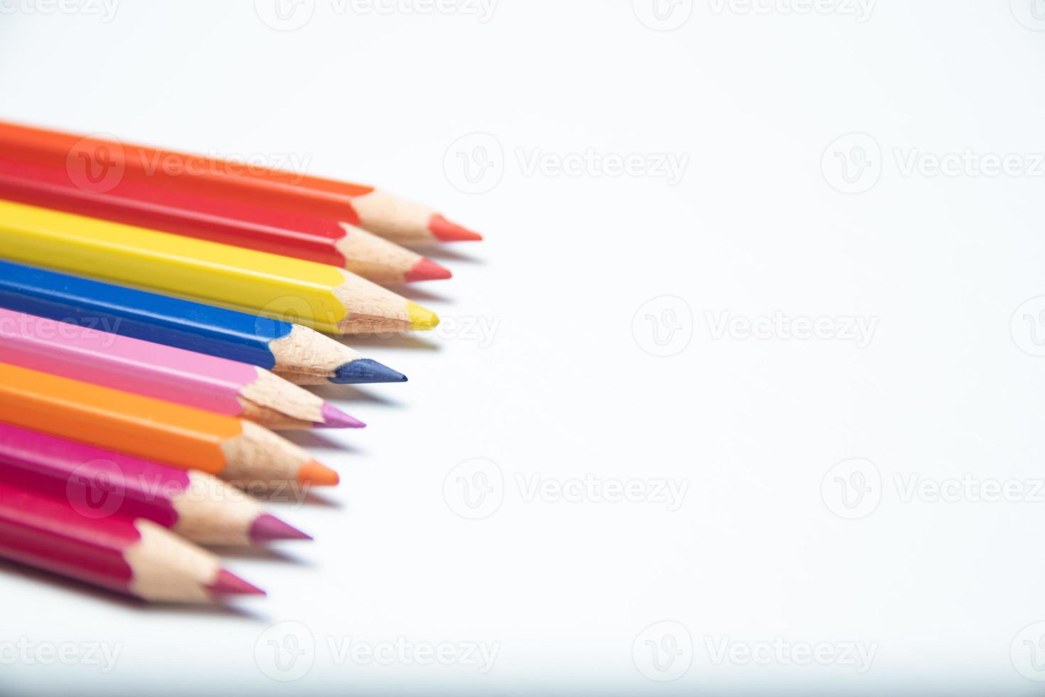 Colorful pencils on white background. Back to school concept. photo