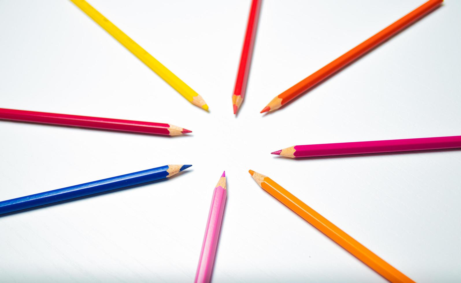 Colorful pencils on white background. Back to school concept. photo