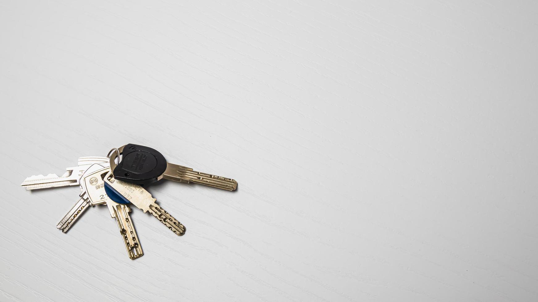 Keys on a white background. The concept of buying a new house. photo