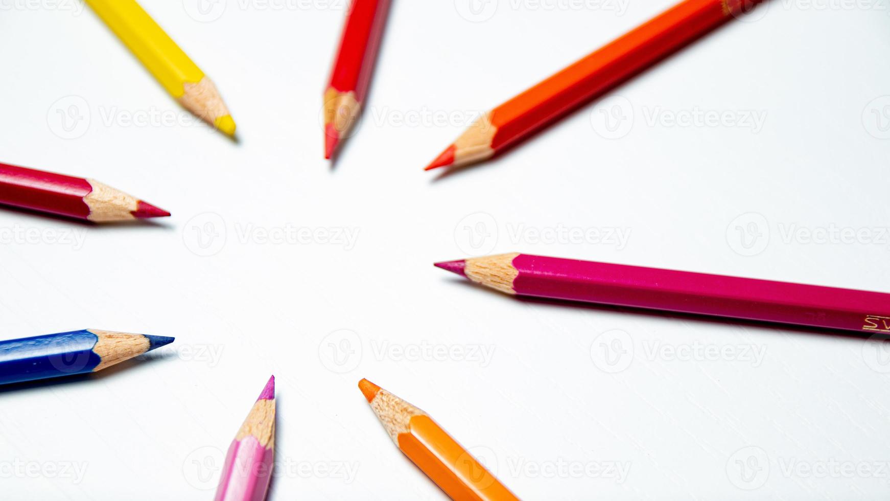 Colorful pencils on white background. Back to school concept. photo