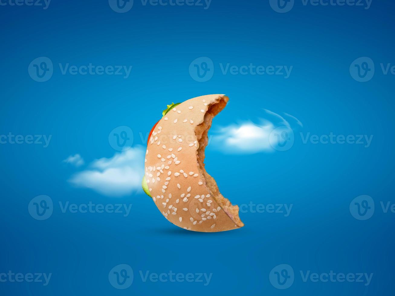 Photo moon shape burger on blue background happy ramadan happy eid concept