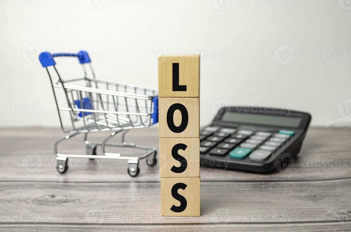 loss Wooden blocks with term text of concept photo