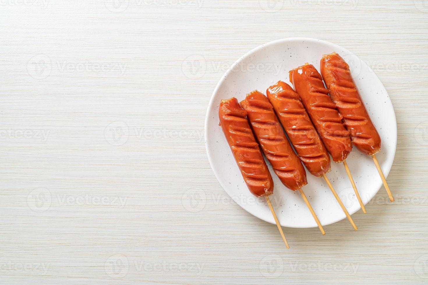 fried sausage skewer on plate photo